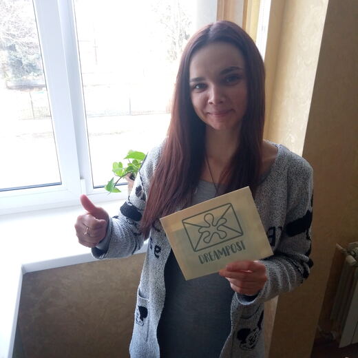 A recipient in a doorway with a delivered envelope.